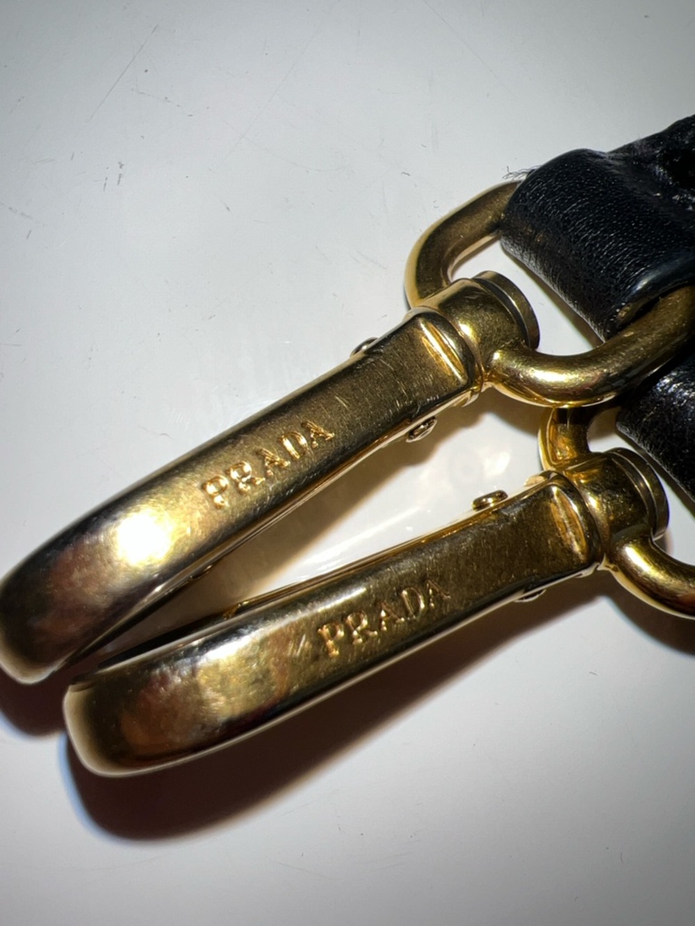 Authentic Prada Gold-Tone Dual Clip  with Black Leather straps 30” inches long